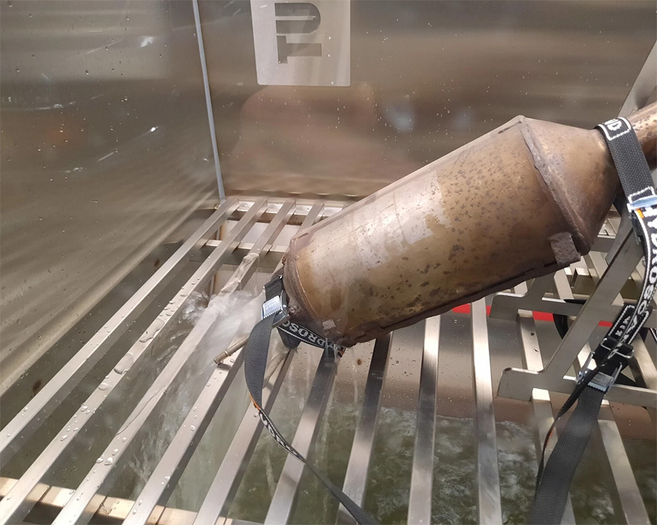 Diesel particulate filter (DPF) being cleaned inside the TurboLaber machine during the professional cleaning process.